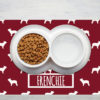Bowl of cat food on wooden background, top view